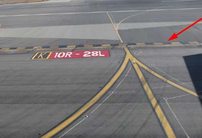 Hold Line (Taxiway K, LiněRunway 10R - 28L)